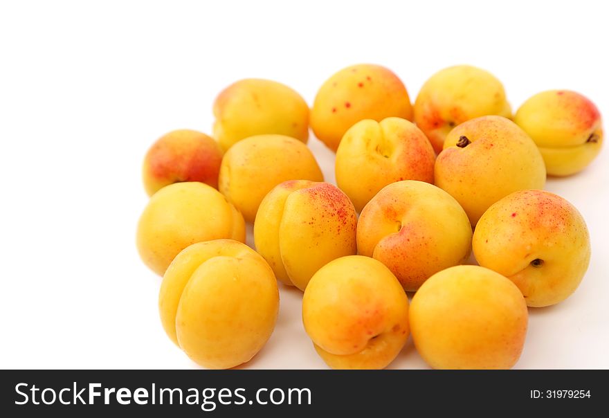 A lot of fresh apricots isolated on a white background