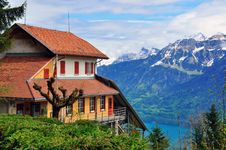 Swiss House And Mountains Royalty Free Stock Photo