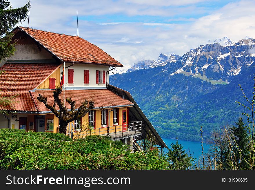 Swiss house and mountains in Alps