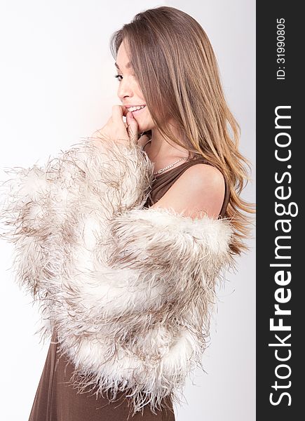 An image of a cute model in a fur coat. An image of a cute model in a fur coat