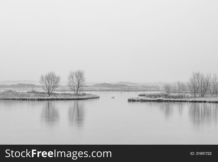 Minimalistic monochrome picture of the lake at Thingvellir area in Iceland