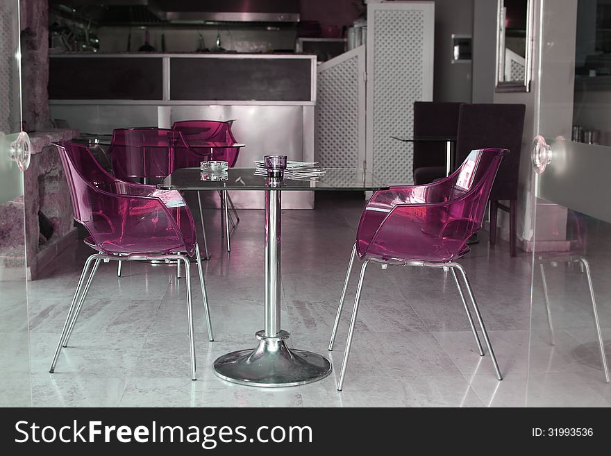 Modern style cafÃ© with plastic chairs. Modern style cafÃ© with plastic chairs.