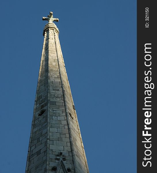 Church steeple with just the tip exposed to light. Church steeple with just the tip exposed to light