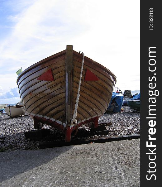 Bow of Wooden Motor Boat on a Beach in Devon. Bow of Wooden Motor Boat on a Beach in Devon