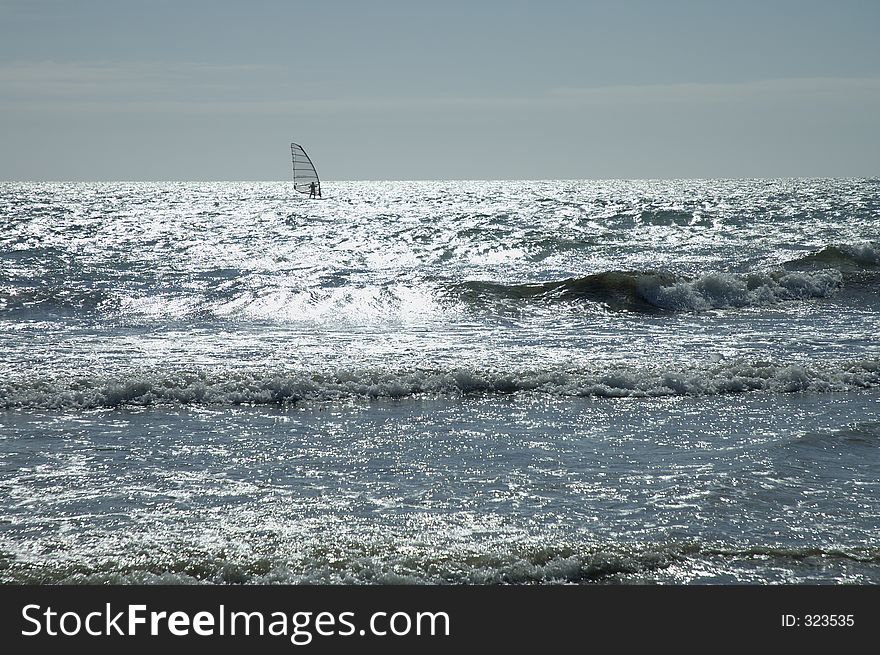 Windsurfer on the sea. Windsurfer on the sea