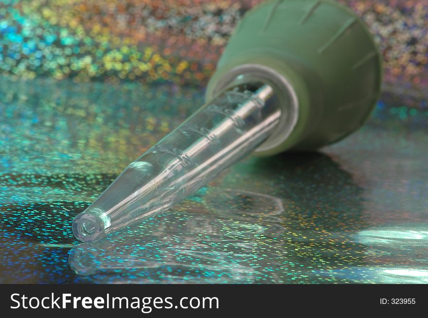 Turkey baster on aqua glitter background