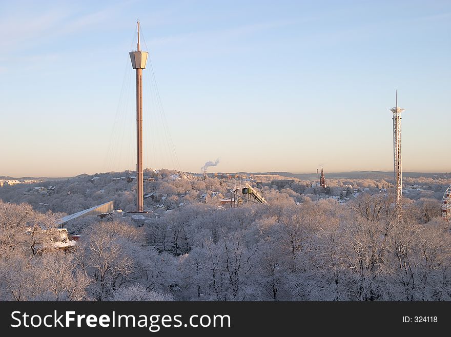 Winter morning: colourful, beautiful panorama sunrise with snow and buildings, Liseberg tower, downtown G�teborg, Sweden