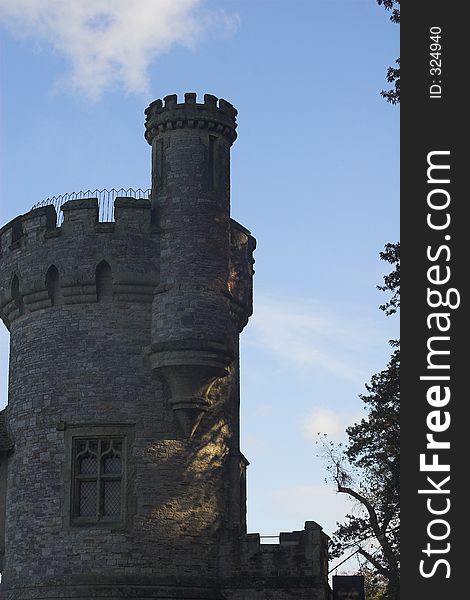 Stone built tower with blue sky in background. Stone built tower with blue sky in background