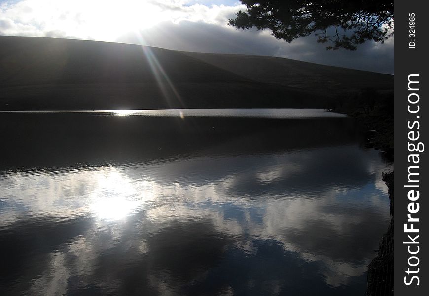 Sun setting over a lake. Sun setting over a lake