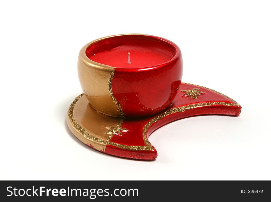 Red christmas candles on various christmas theme candleholders. Red christmas candles on various christmas theme candleholders.