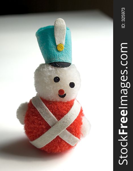 A small fuzzy ornament of a soldier snow man. A small fuzzy ornament of a soldier snow man