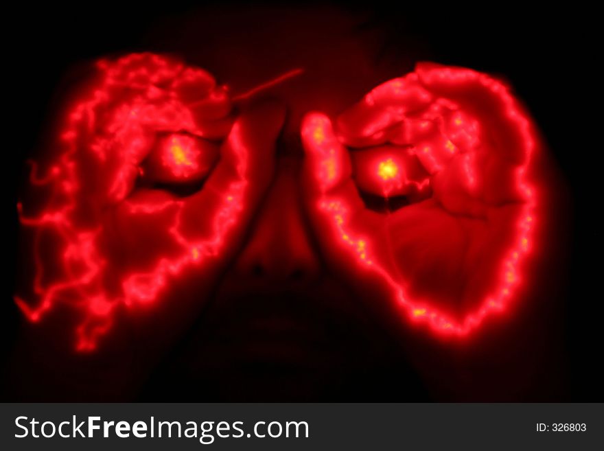 Man with glowing hands at his eyes. Man with glowing hands at his eyes