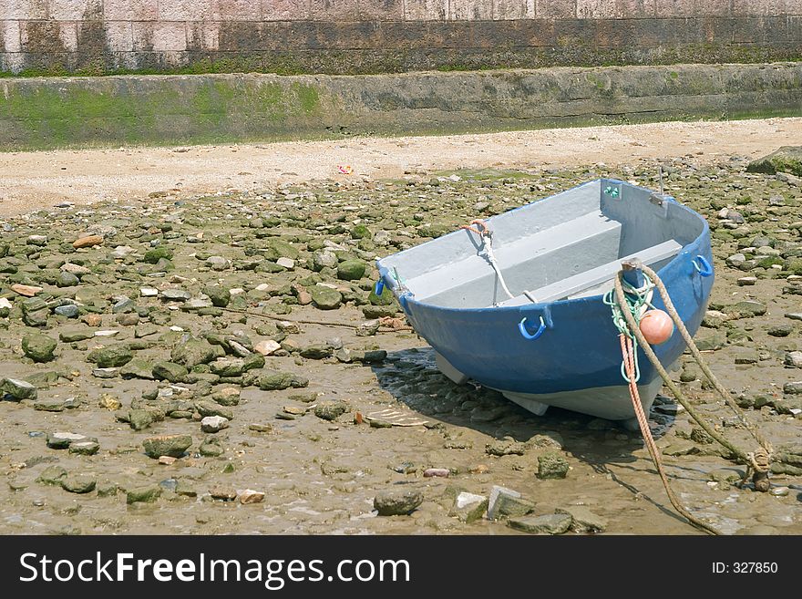 Tied Down Boat With Low Tide In The Bay Of Cadiz