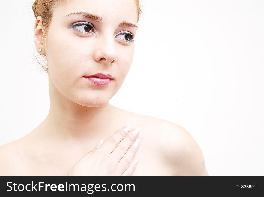 Girl preparing for a salon session with an expression of purity. Girl preparing for a salon session with an expression of purity