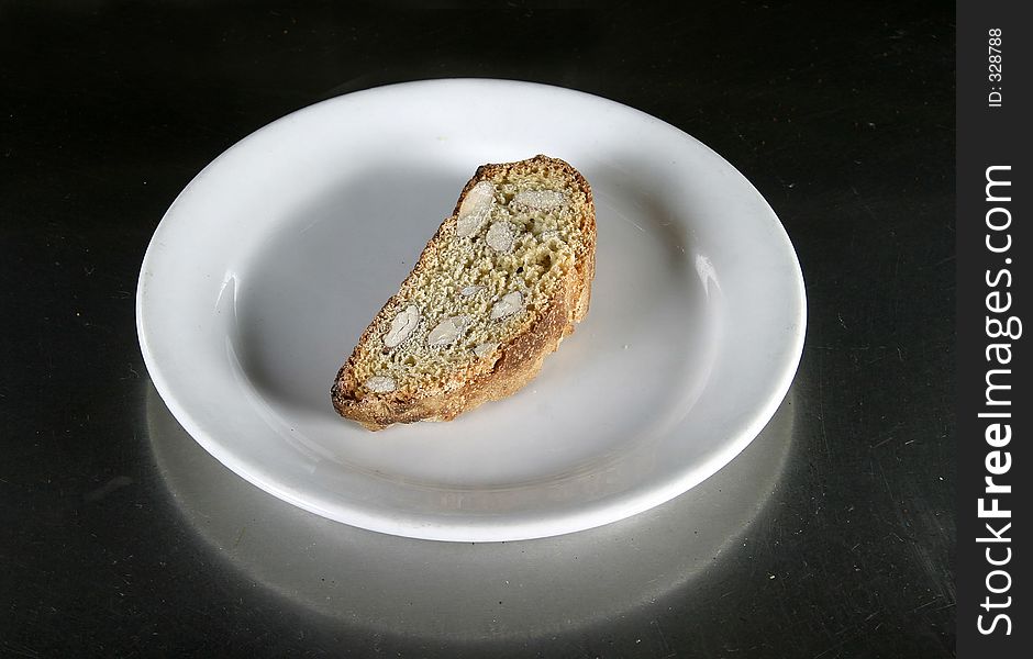 Biscotti on a plate on an aluminum table