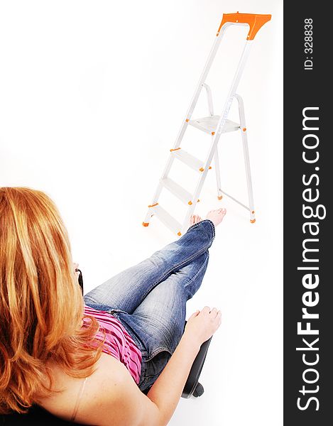 Sporty dressed girl resting in the studio. Sporty dressed girl resting in the studio