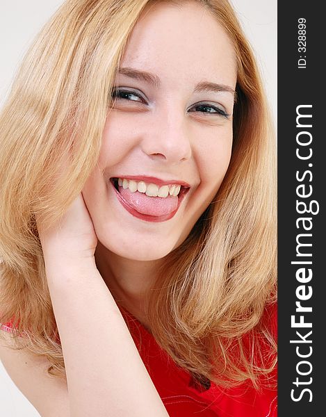 Beautiful blond girl smiling innocently. Beautiful blond girl smiling innocently