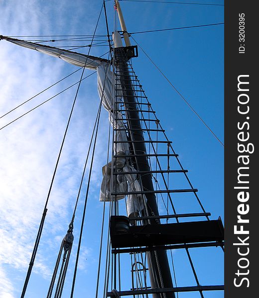 A sail on a boat under the clear blue sky