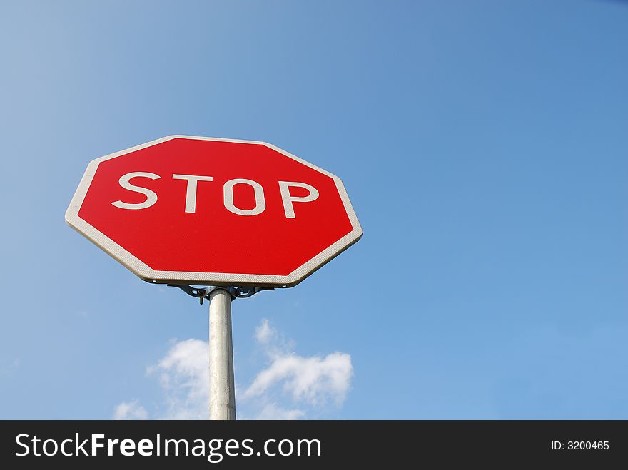 Stop sign. white text stop in red plate