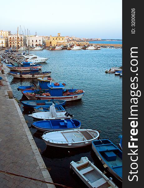 Boats of fishermen in the port of Gallipoli, Italy