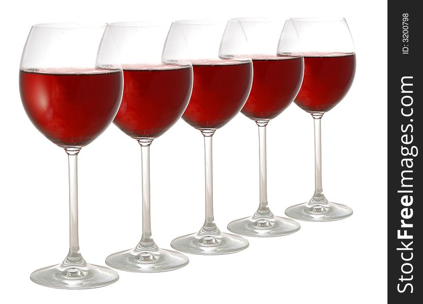 Five glasses of red wine isolated on white background