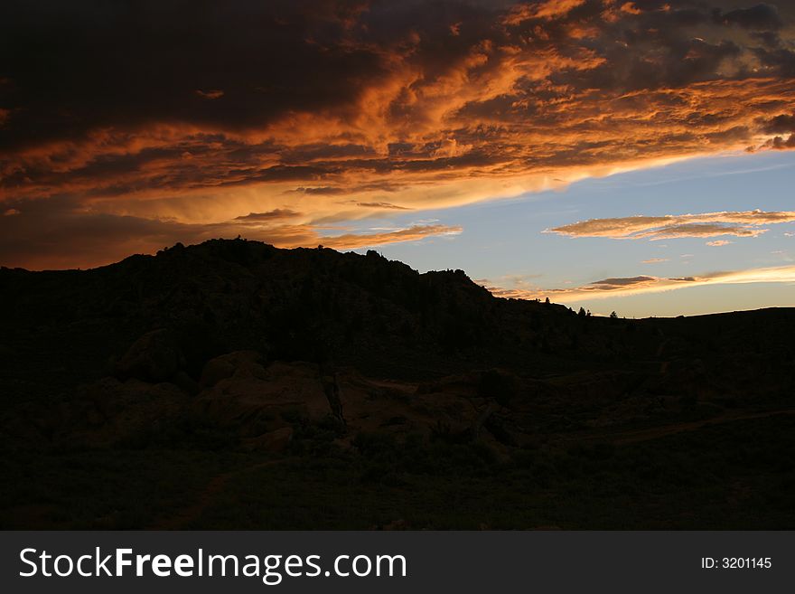 With a storm coming, the sunset lights the clouds in unique ways. With a storm coming, the sunset lights the clouds in unique ways.