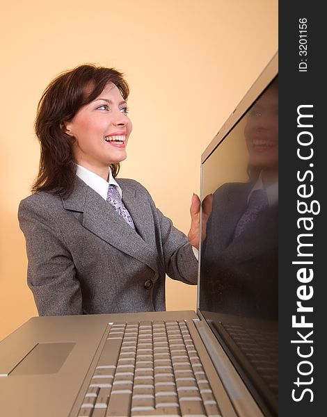 Smiling girl with laptop in her hands