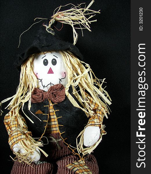 Scarecrow doll isolated on black. Scarecrow doll isolated on black.