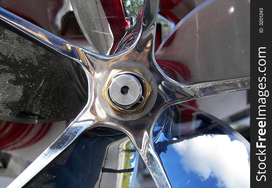 Shiny expensive new propeller on a racing boat.