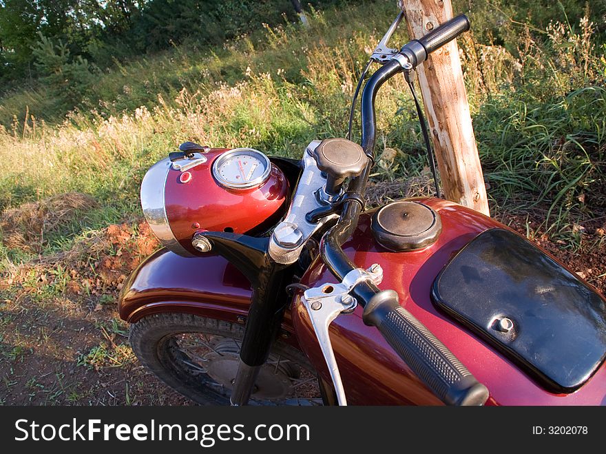 Dark-red russian renewed retro motorcycle