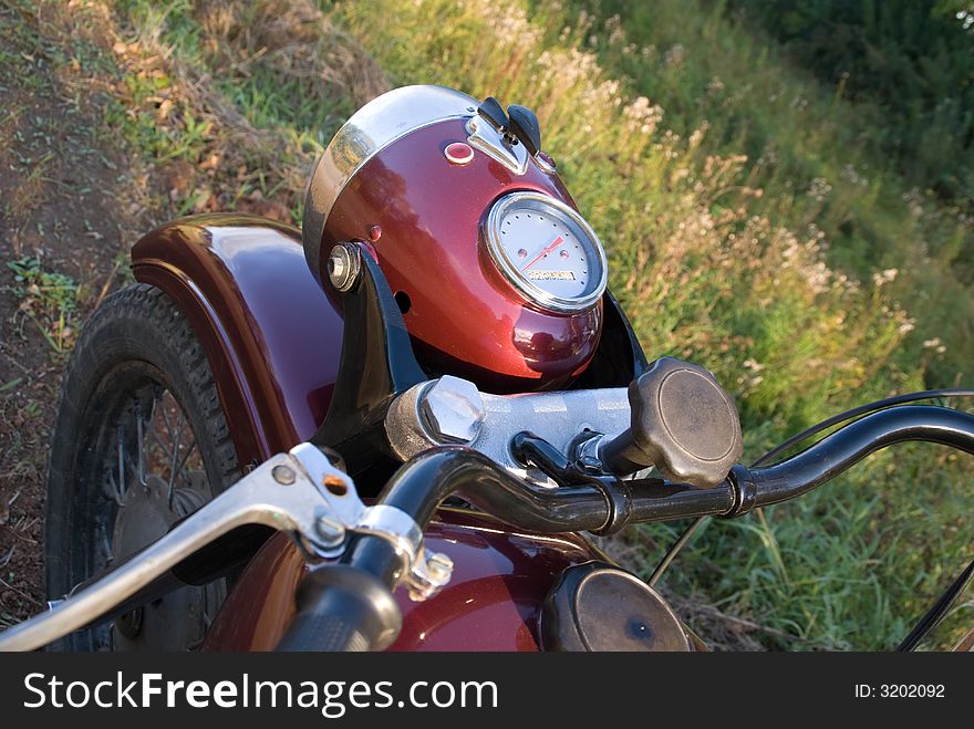 Dark-red russian renewed retro motorcycle