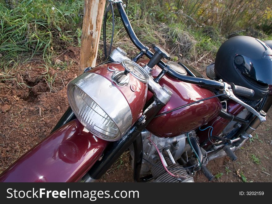 Dark-red russian renewed retro motorcycle