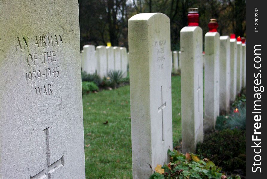 A soldiers grave  in a military graveyard.
