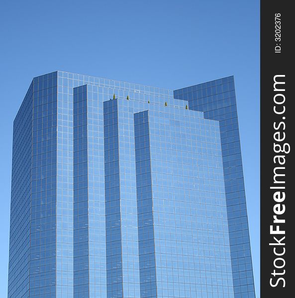 A new skyscraper reflects the blue sky in Bellevue, Washington. A new skyscraper reflects the blue sky in Bellevue, Washington.