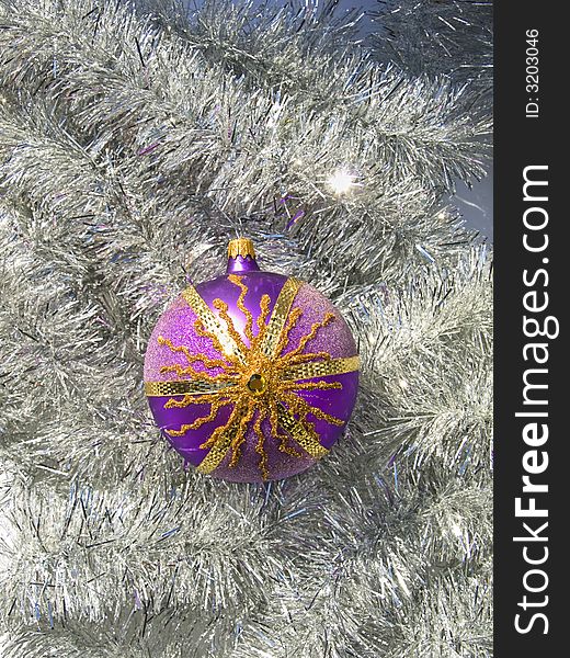 Colorful sparkly Christmas ball on a silver decoration. Colorful sparkly Christmas ball on a silver decoration