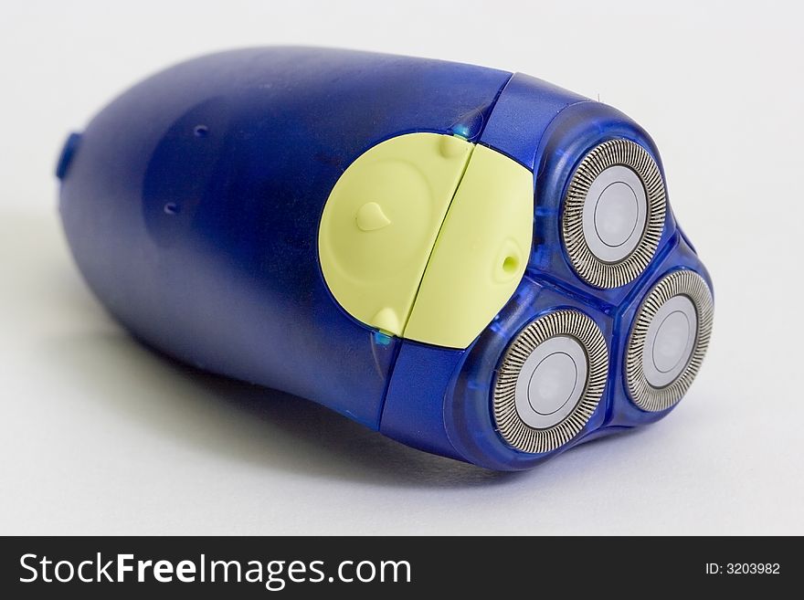 Blue electric shaver, white background