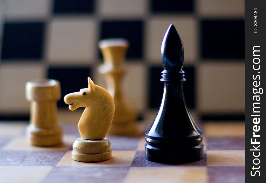 Black and white chess figure on board