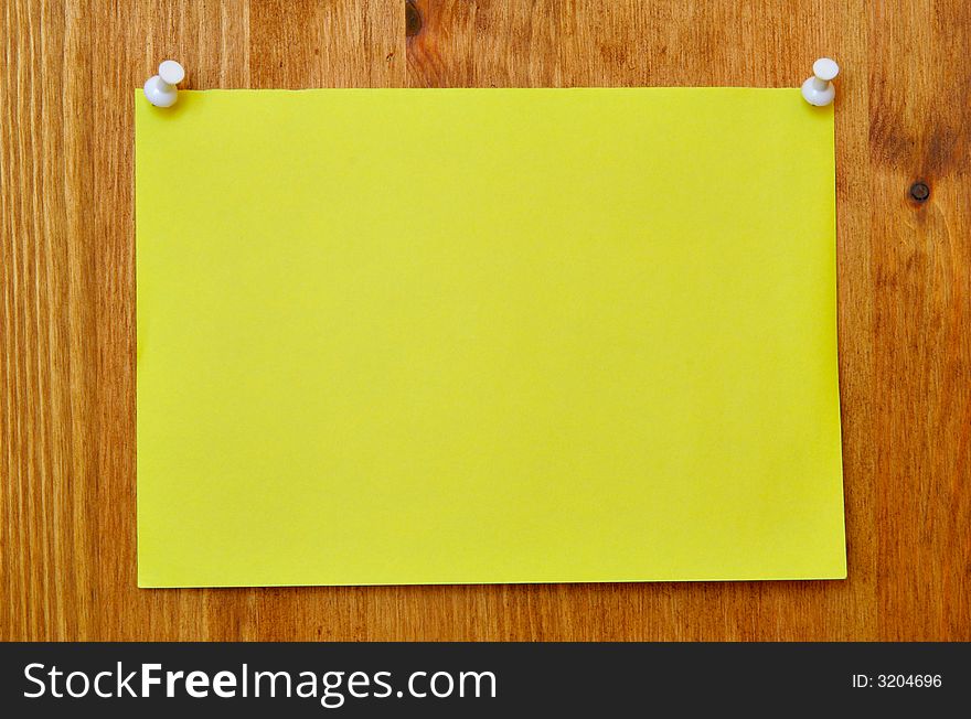 Single blank sheet attached to a wooden wall. Single blank sheet attached to a wooden wall