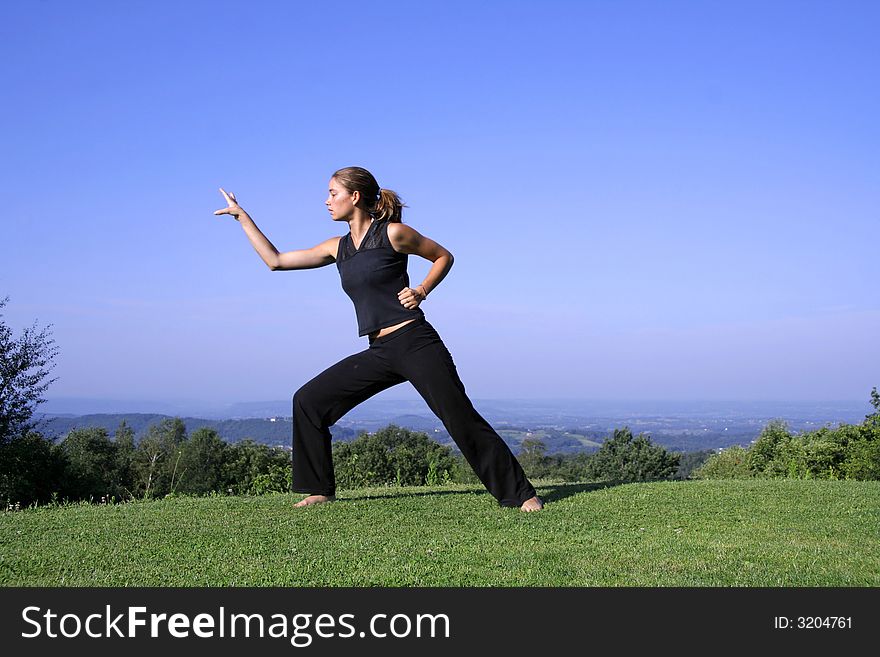 Attractive young woman practising self defense