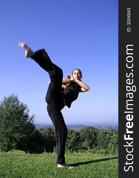 Attractive young woman practising self defense
