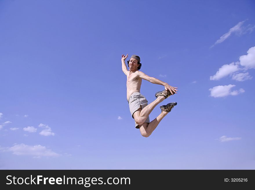 Healthy happy man jumping in joy of life