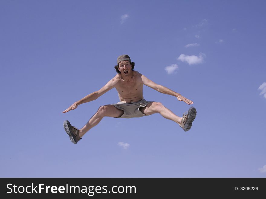 Healthy happy man jumping in joy of life