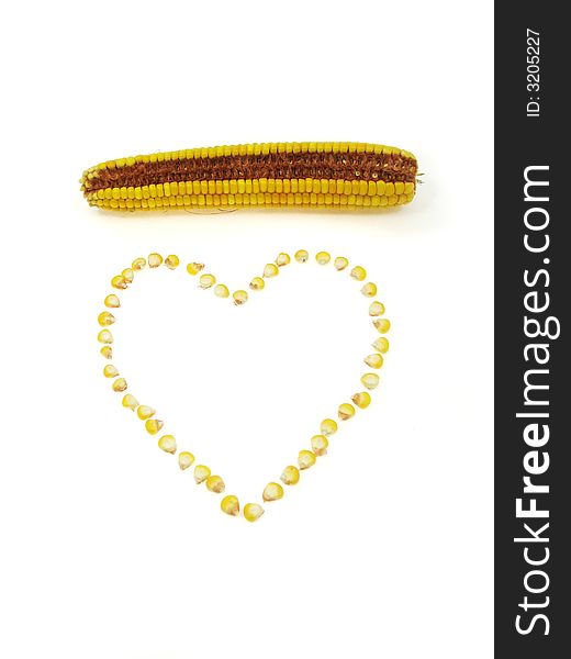 A heart of sweet corn kernels isolated on a white background. A heart of sweet corn kernels isolated on a white background