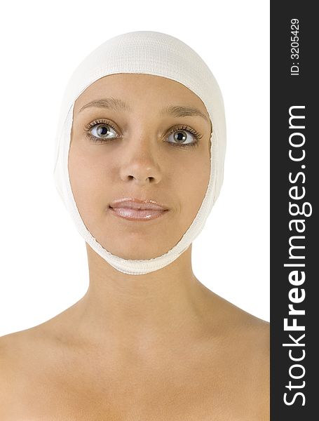 Young, beautiful woman with bandage on head. Smiling and looking at something. Front view, white background. Young, beautiful woman with bandage on head. Smiling and looking at something. Front view, white background