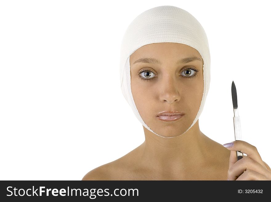 Young, beautiful woman with bandage on head and scalpel in hand. Looking at camera. Front view, white background. Young, beautiful woman with bandage on head and scalpel in hand. Looking at camera. Front view, white background