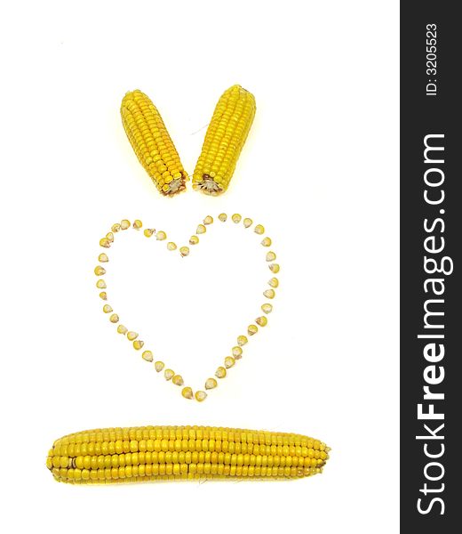 A heart of sweet corn kernels isolated on a white background. A heart of sweet corn kernels isolated on a white background