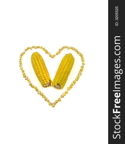 A heart of sweet corn kernels isolated on a white background. A heart of sweet corn kernels isolated on a white background