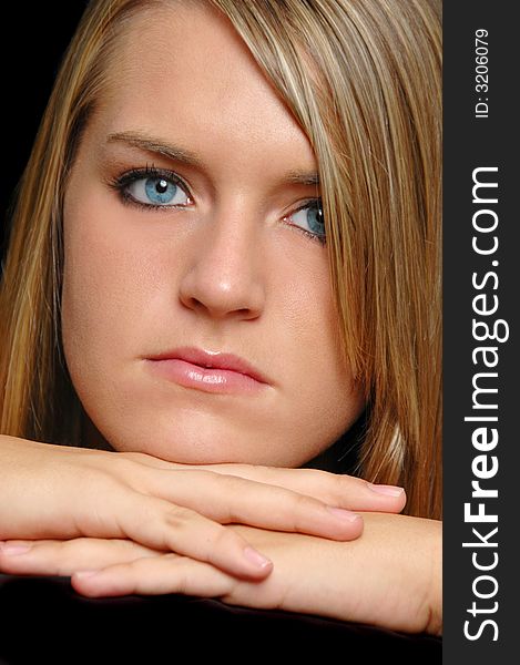 Beautiful teen portrait close up isolated on black. Beautiful teen portrait close up isolated on black