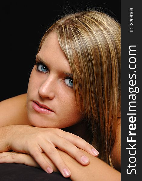 Beautiful teen portrait close up isolated on black