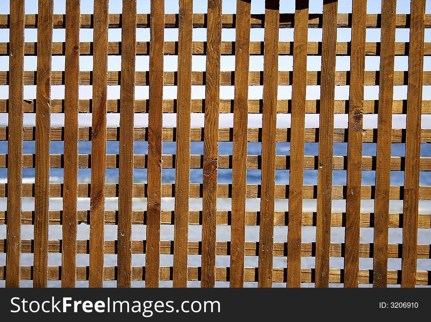 Wooden fence pattern on red sea background, sinai, egypt